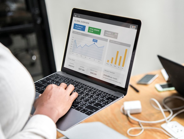 Business owner reviewing Google Business Profile performance insights on a laptop
